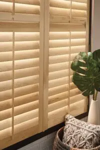 A close up of a window with blinds closed